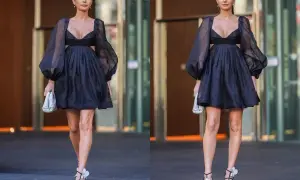 Elegancka czarna sukienka z bufiastymi rękawami i wycięciami. Idealna stylizacja, jak się ubrać na 40 urodziny w lokalu.