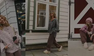Uśmiechnięta basic girl w różowym sweterku i brązowych spodniach, spacerująca w beżowych klapkach.