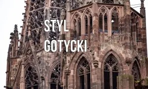 Kamienna wieża katedry w stylu gotyckim, z misternymi detalami i łukami.