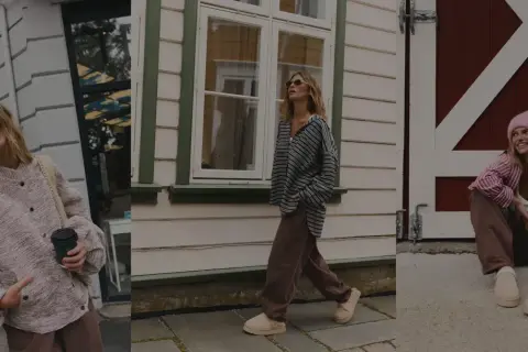 Uśmiechnięta basic girl w różowym sweterku i brązowych spodniach, spacerująca w beżowych klapkach.