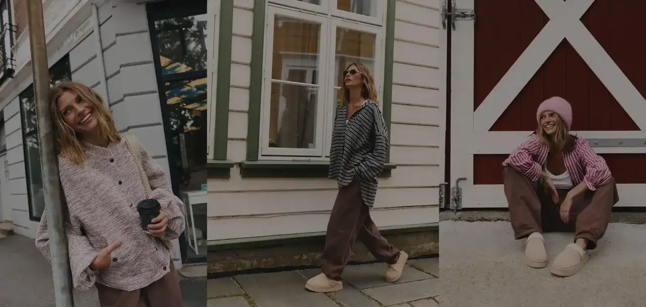 Uśmiechnięta basic girl w różowym sweterku i brązowych spodniach, spacerująca w beżowych klapkach.
