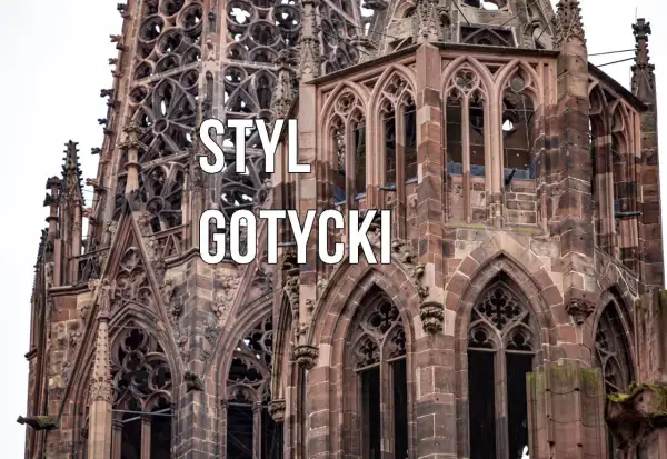 Kamienna wieża katedry w stylu gotyckim, z misternymi detalami i łukami.